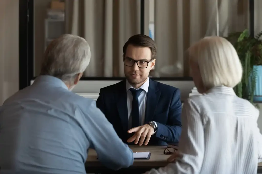 Financial expert attracting high net worth clients at a business meeting.