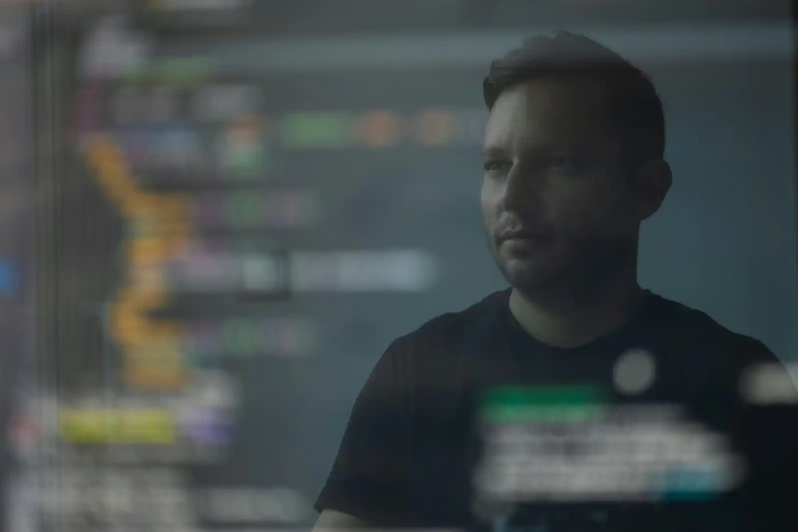 Cryptocurrency company owner in front of bitcoin on laptop screen