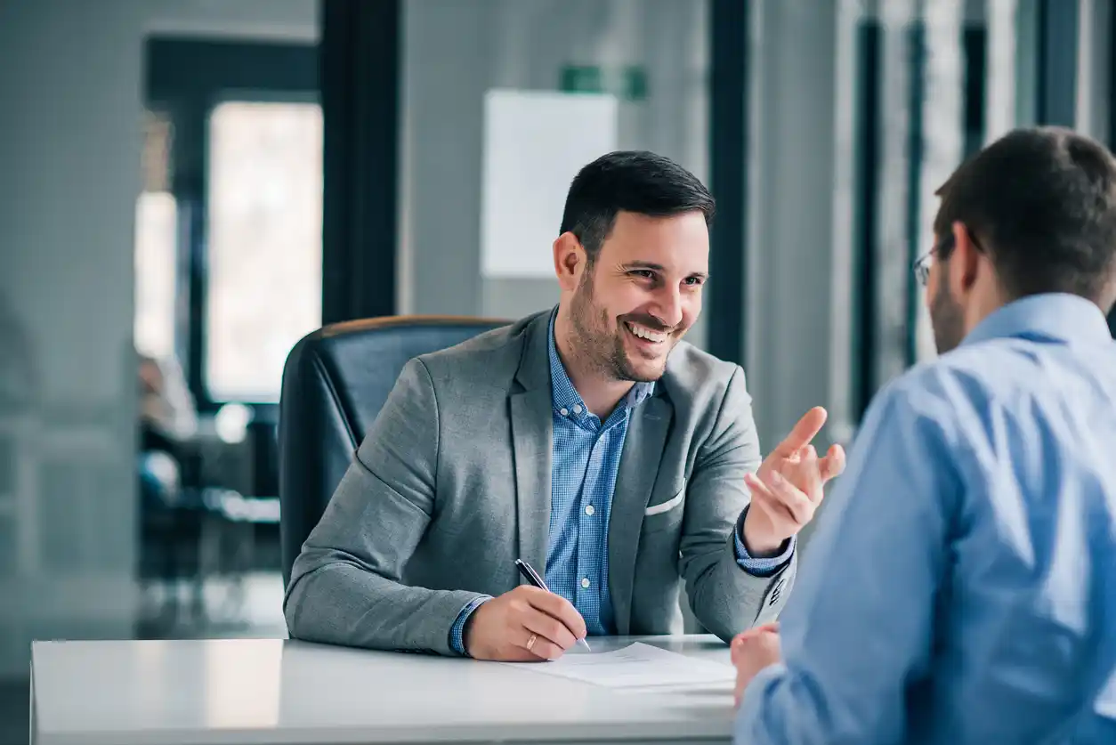 an accountant sitting at a table with client